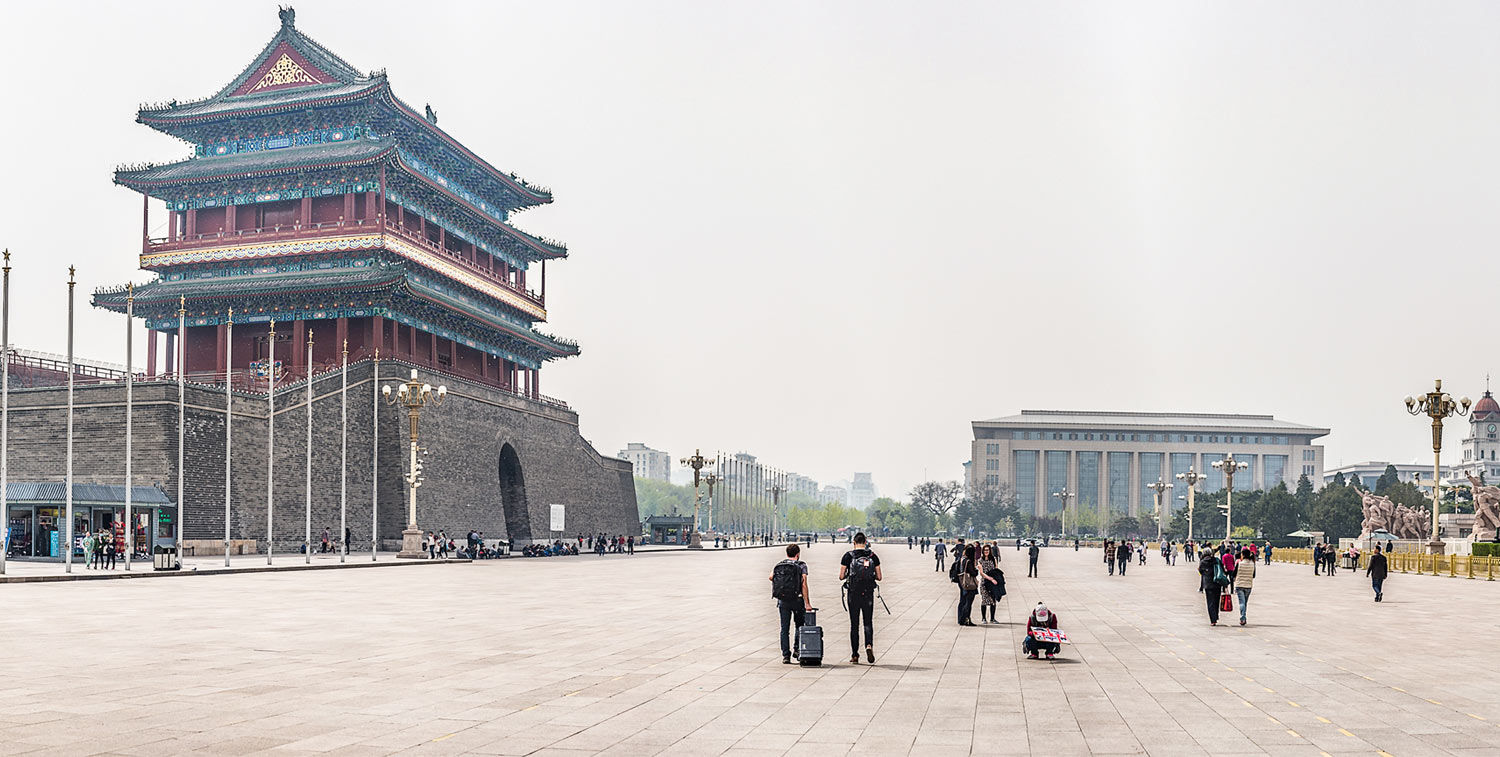 People walking in Tiananmen Square near the Gate of Heavenly Peace.