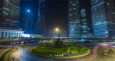 A busy nighttime street scene in Shanghai.