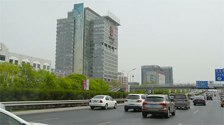 A busy nighttime street scene in Shanghai.