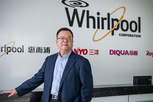 Ian Lee stands in front of the Whirlpool, Sanyo and Diqua signs at the company’s factory facilities in Hefei, China.